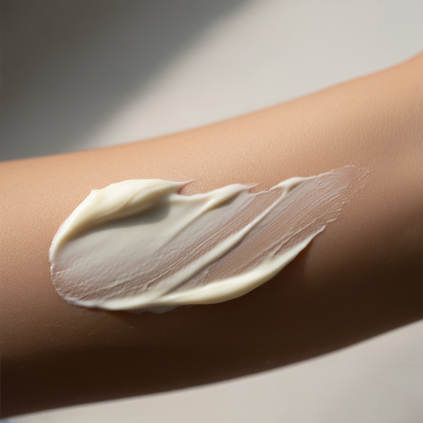 SOD cream applied to a person's arm on a neutral background
